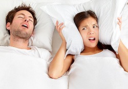 A woman who can’t sleep due to her husband snoring