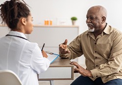 A man talking to his physician about sleep apnea
