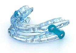 A sleep apnea orthotic device