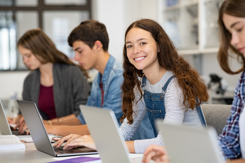 Child smiling with good dental health at school