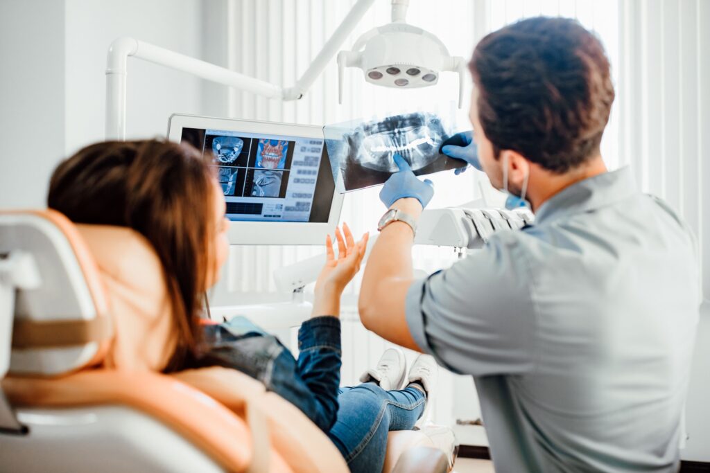 Dentist showing patient her x-rays